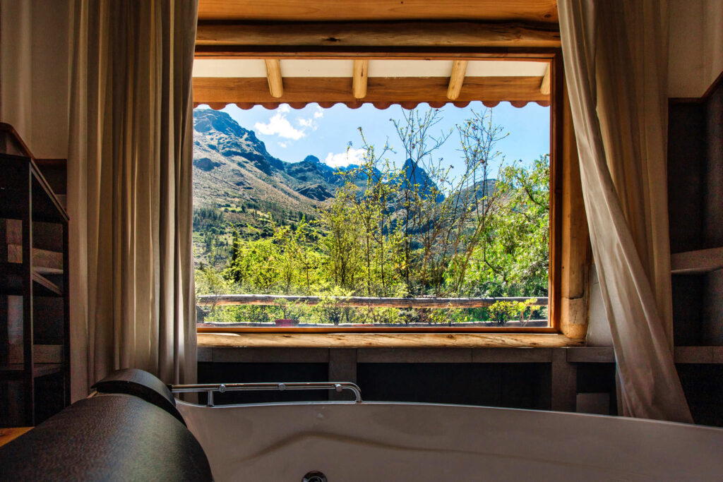 Luxurious jacuzzi with a breathtaking view of the Andean mountains, offering a serene soak in nature