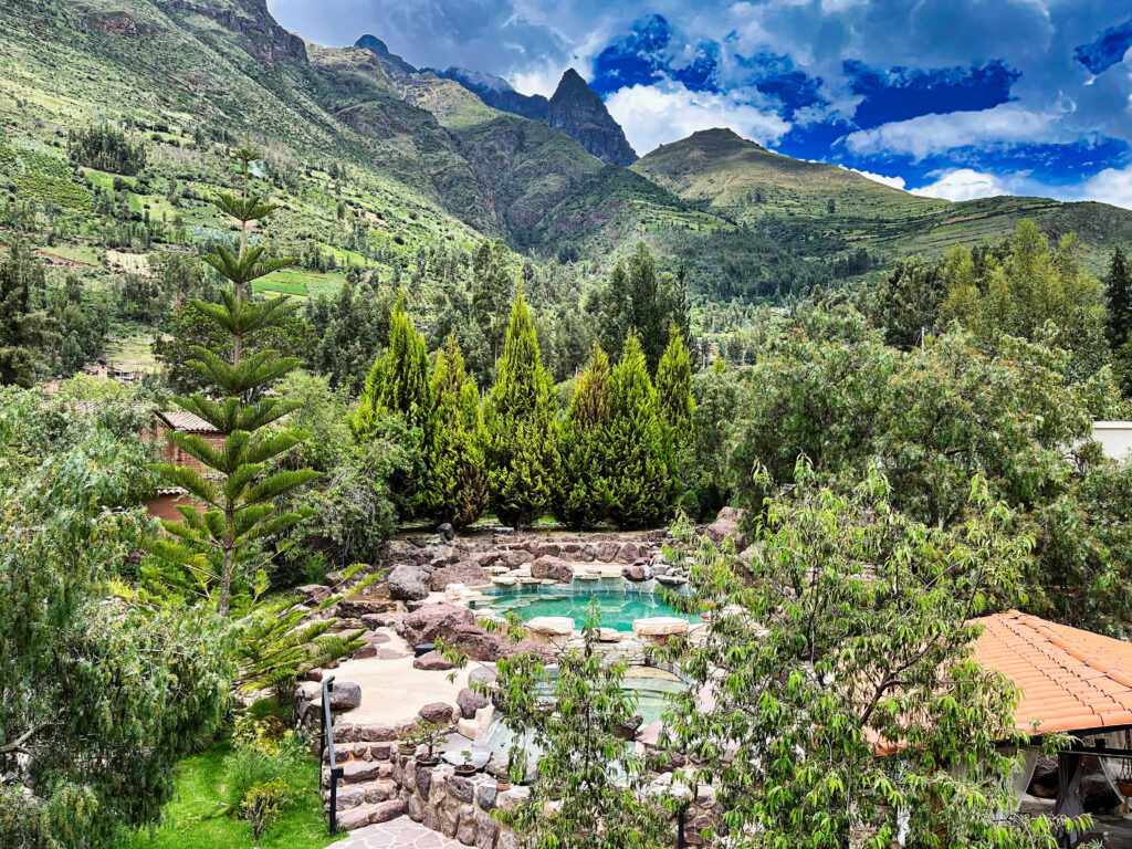 Serenity unfolds in this luxury retreat’s pool oasis, nestled among the vibrant greenery of Peru’s Sacred Valley, under the watchful gaze of the Andean peaks