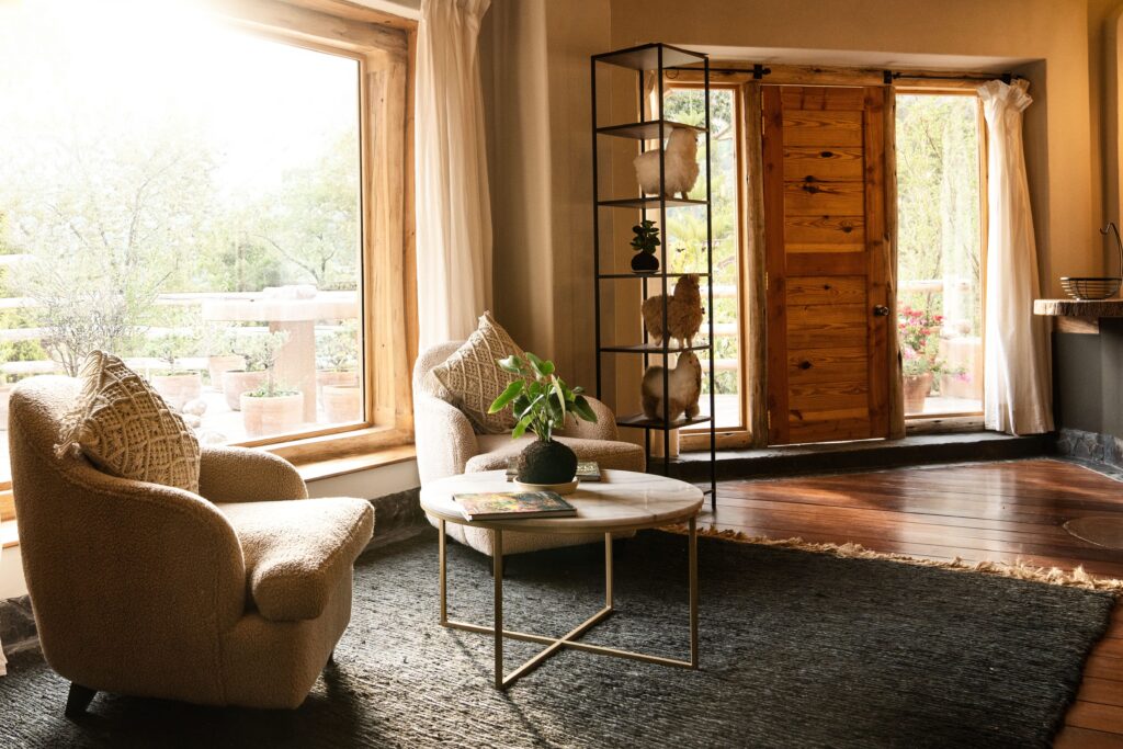 Cozy lounge area with plush seating and natural light at the luxury ayahuasca retreat in Sacred Valley, Peru