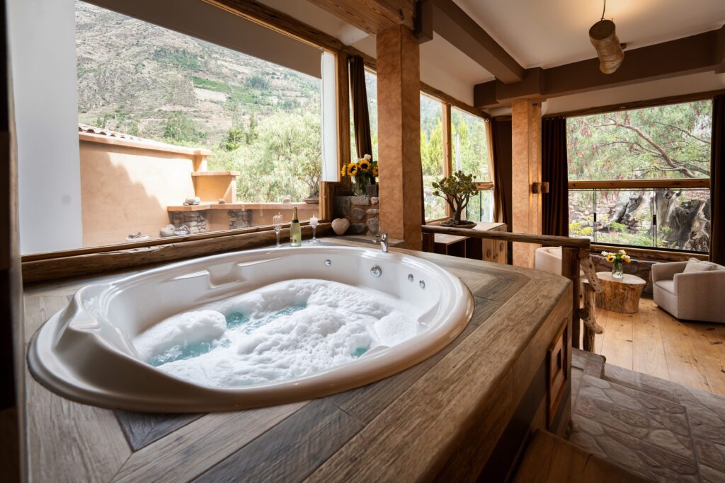 Inviting jacuzzi with scenic mountain views at a luxury ayahuasca retreat in Sacred Valley, Peru